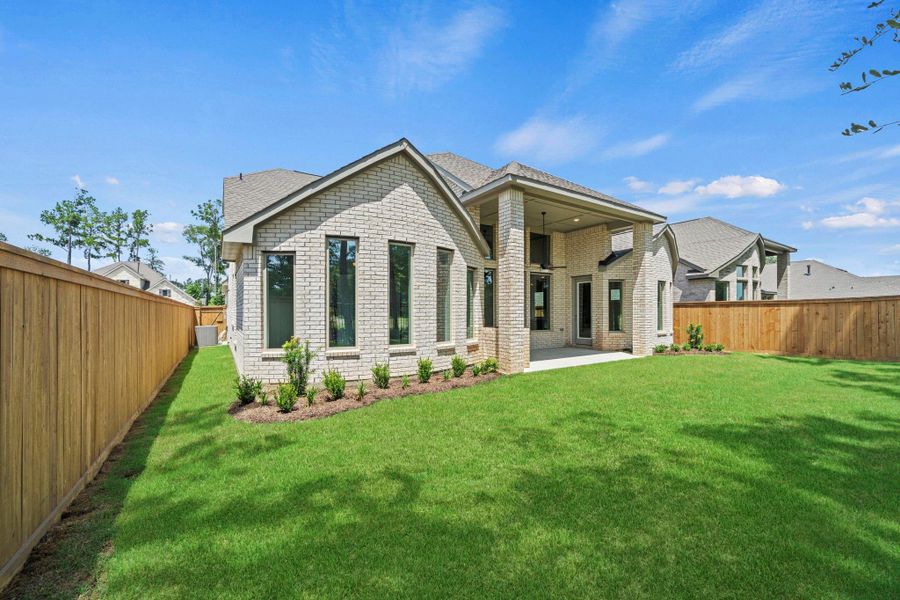 Exterior details and patio area of a home in The Highlands, Porter (Image 23).