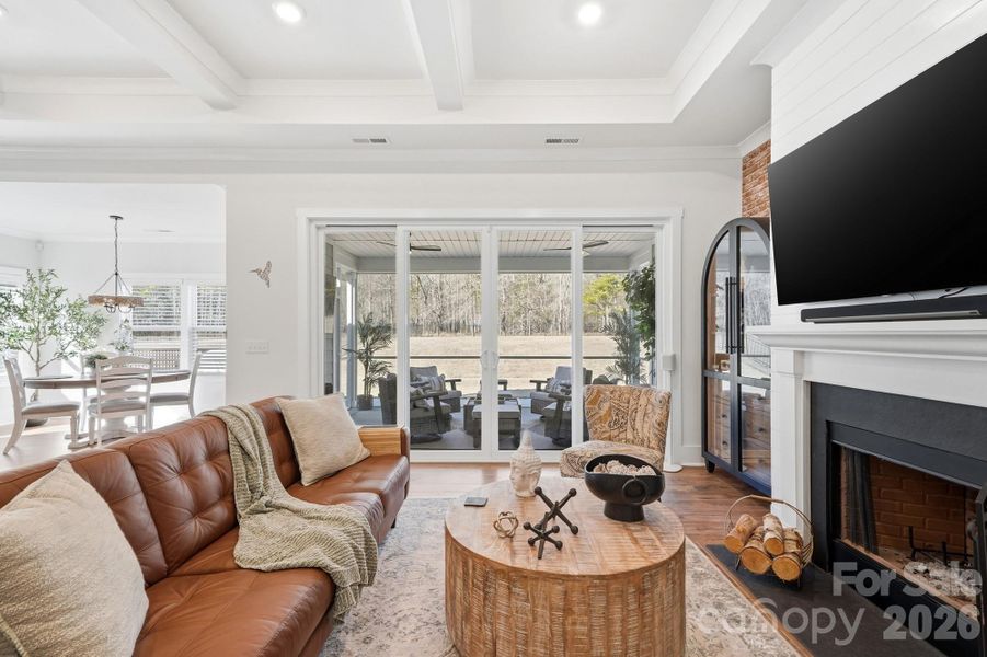 Sliders open onto a spacious screened porch