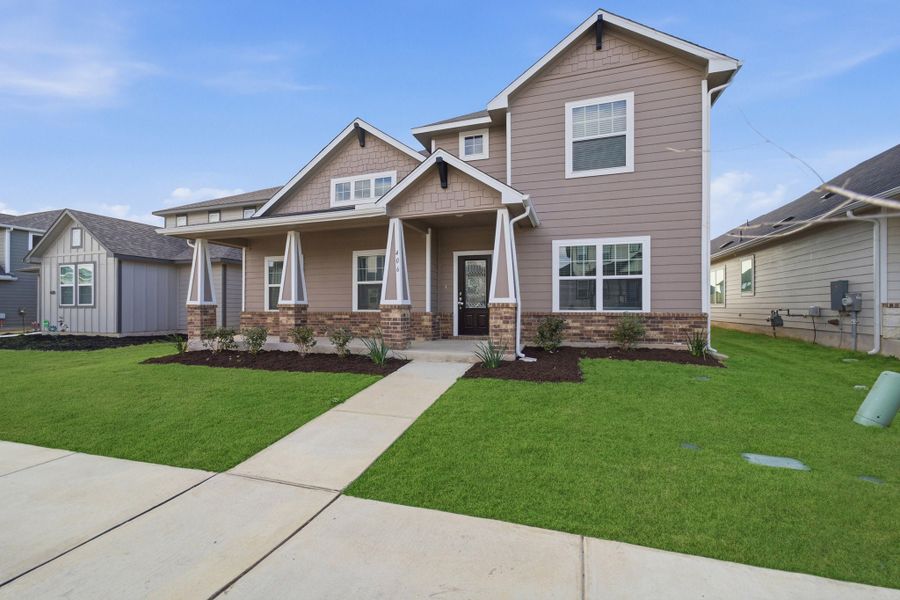Front exterior of a new home in Brooklands, Hutto, TX, highlighting curb appeal (Image 2). Front exterior of a new home in Brooklands, Hutto, TX, highlighting curb appeal (Image 2).