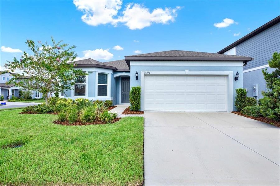 Front exterior of a new home in , Land O' Lakes, FL, highlighting curb appeal (Image 21).