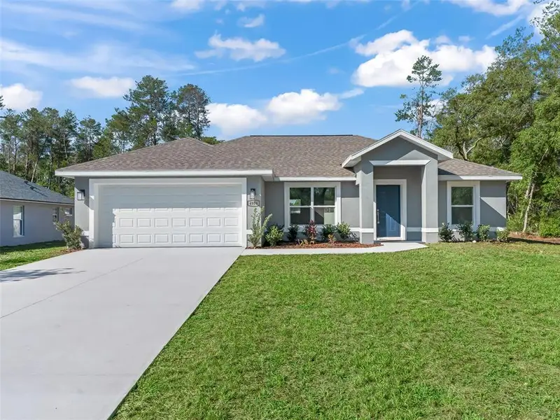 Front exterior of a new home in , Ocala, FL, highlighting curb appeal (Image 22).