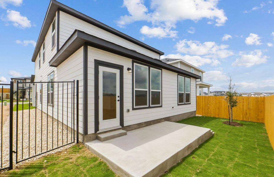 Exterior details and patio area of a home in Cameron Place, Manor (Image 3).