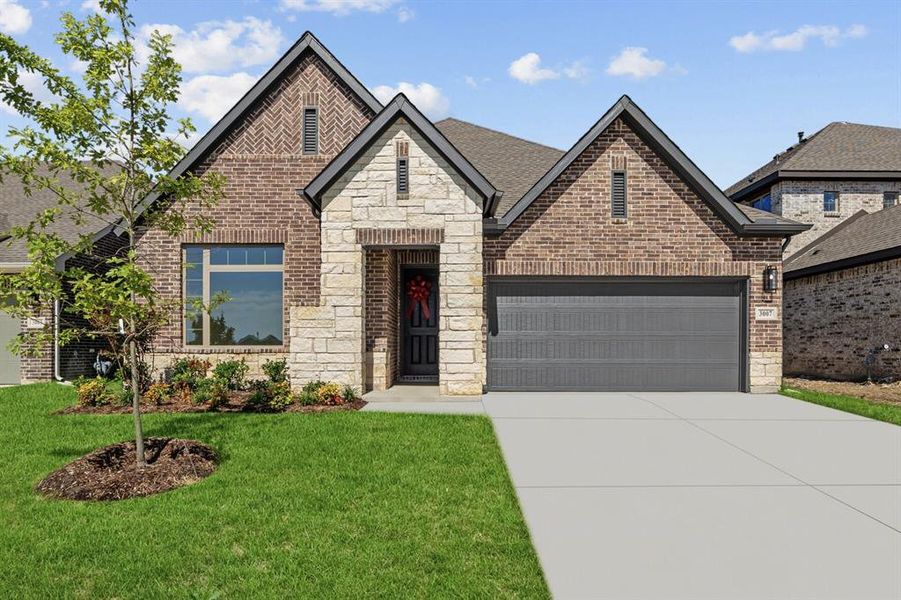 Front exterior of a new home in Creekshaw – Classic, Royse City, TX, highlighting curb appeal (Image 2). Front exterior of a new home in Creekshaw – Classic, Royse City, TX, highlighting curb appeal (Image 2).