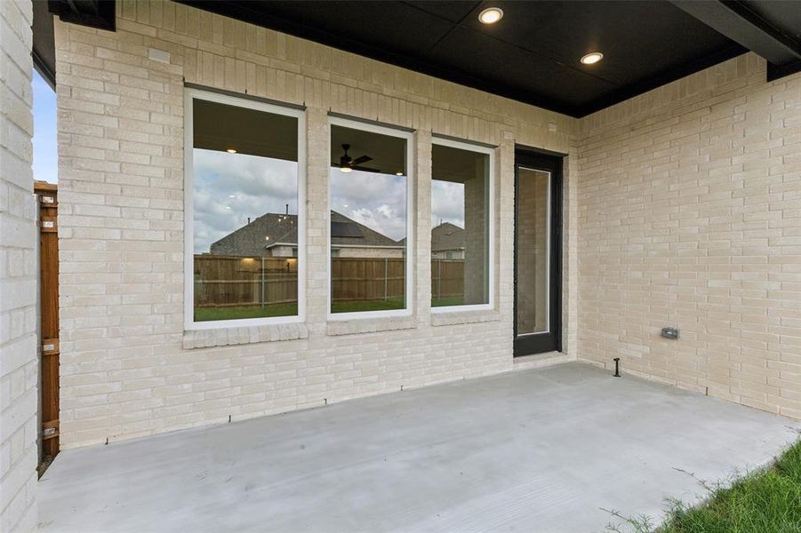 Dining al fresco is in your future on this spacious covered back patio.