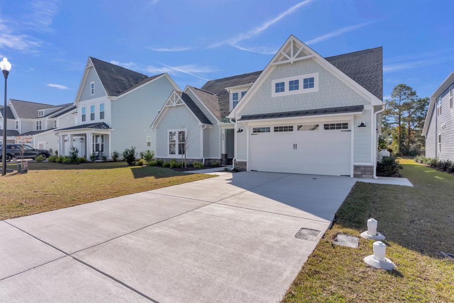 Representative exterior photo of a completed home built from the The Bradley by RobuckHomes in Windwater, Hampstead, NC (Image 32).
