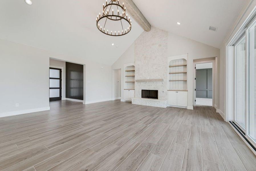 Living room facing fireplace and entry Living room facing fireplace and entry