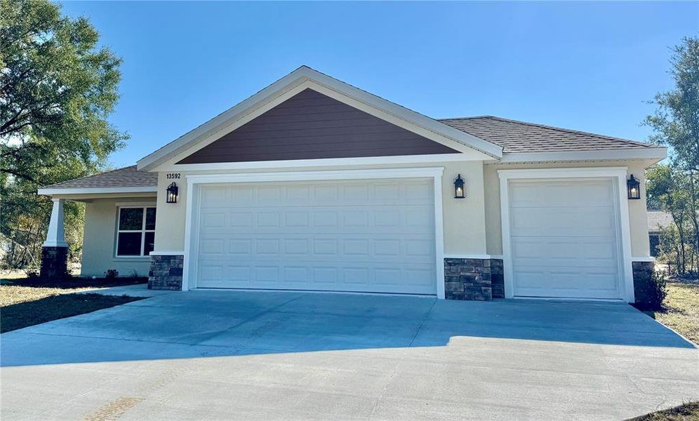 Front exterior of a new home in , Dunnellon, FL, highlighting curb appeal (Image 2). Front exterior of a new home in , Dunnellon, FL, highlighting curb appeal (Image 2).
