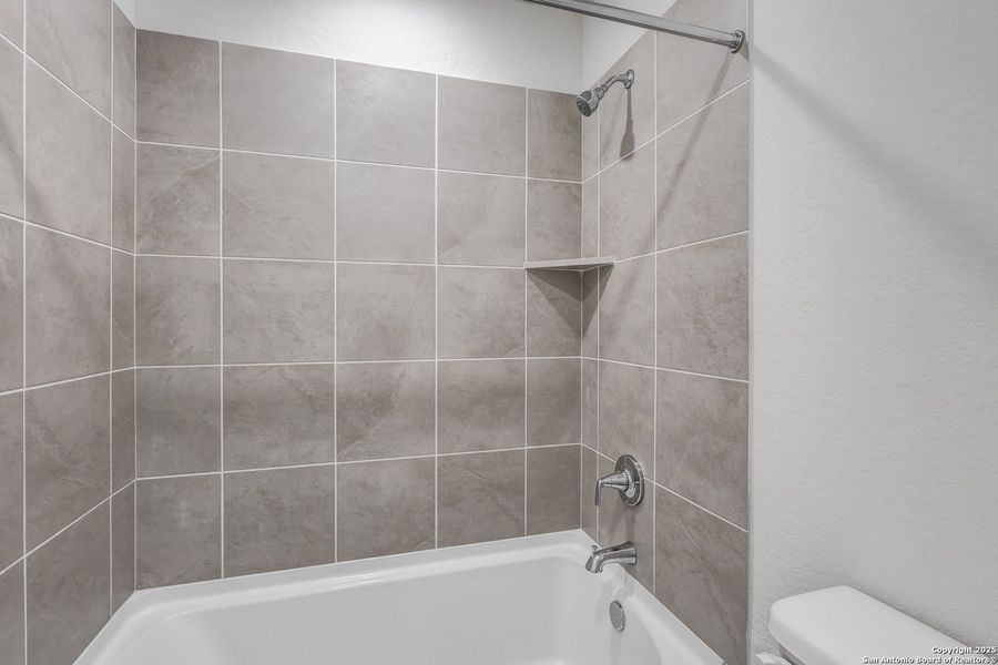 Furnished interior in a model home at Cinco Lakes in San Antonio (Image 13).