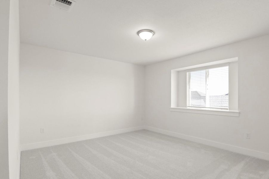 Spare room with light carpet Spare room with light carpet