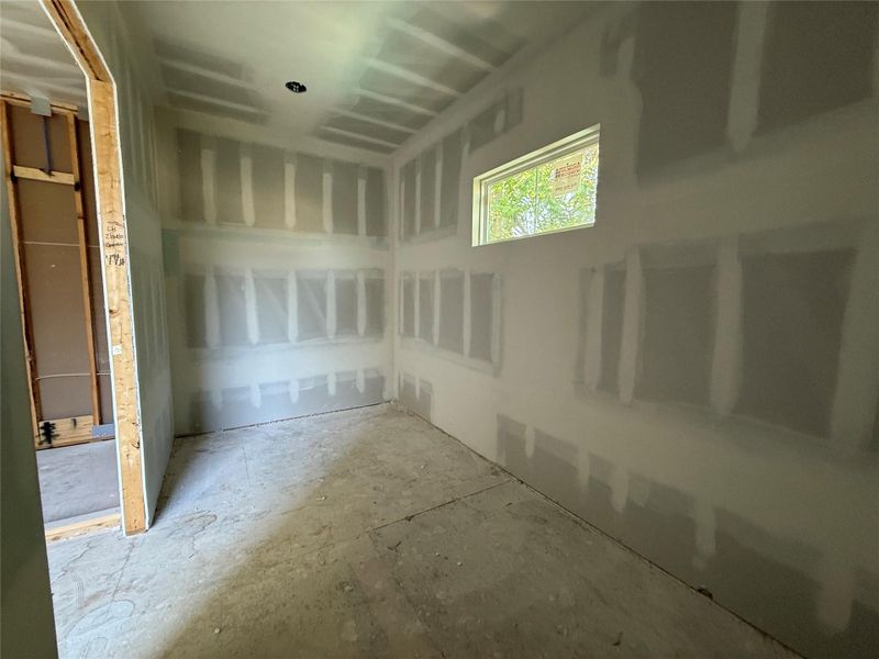 Primary bedroom has two separate closets. One oversized closet is attached the bathroom here. The other is attached to the bedroom.