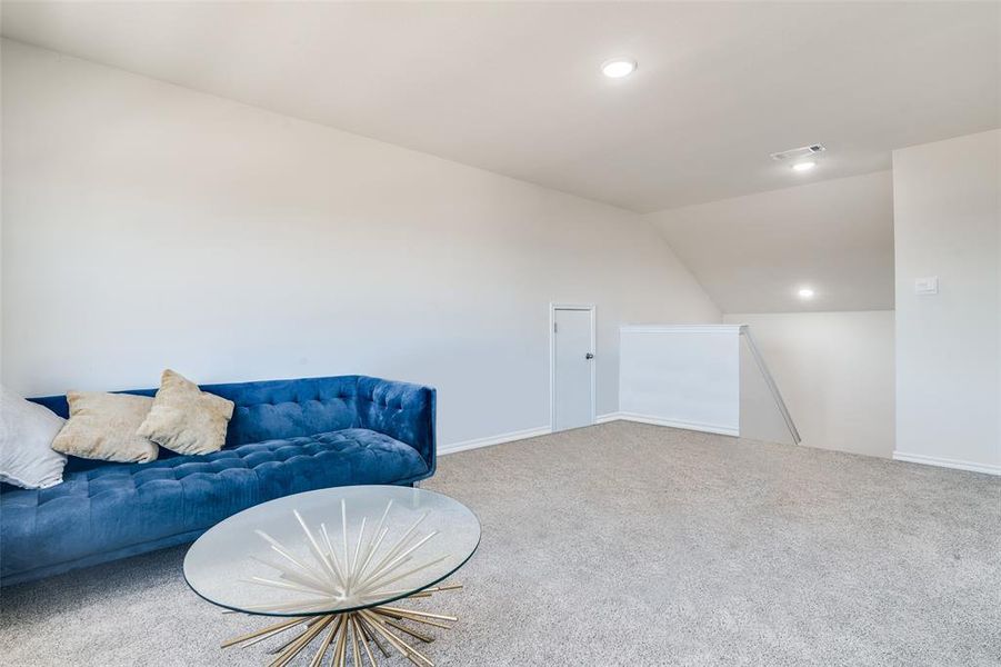 Sitting room with carpet, lofted ceiling, and recessed lighting