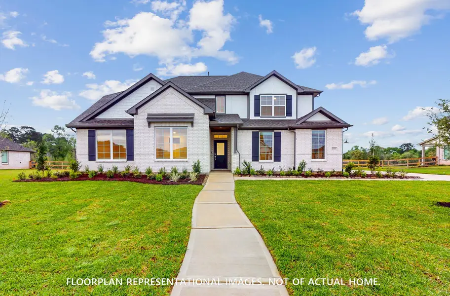 Front exterior of a new home in Lone Star Landing, Montgomery, TX, highlighting curb appeal (Image 2). Front exterior of a new home in Lone Star Landing, Montgomery, TX, highlighting curb appeal (Image 2).