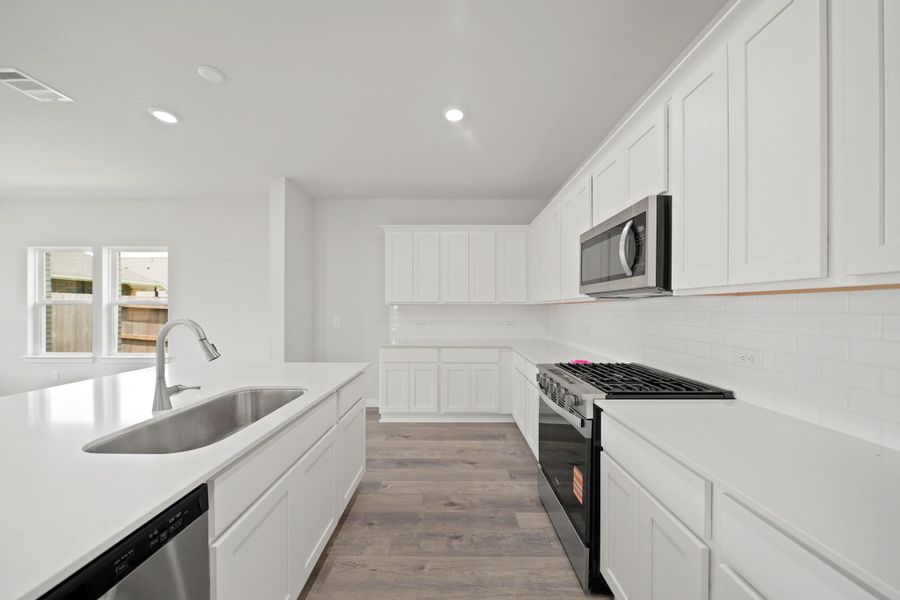 Furnished interior view inside a new home in Sunterra, Katy (Image 4).