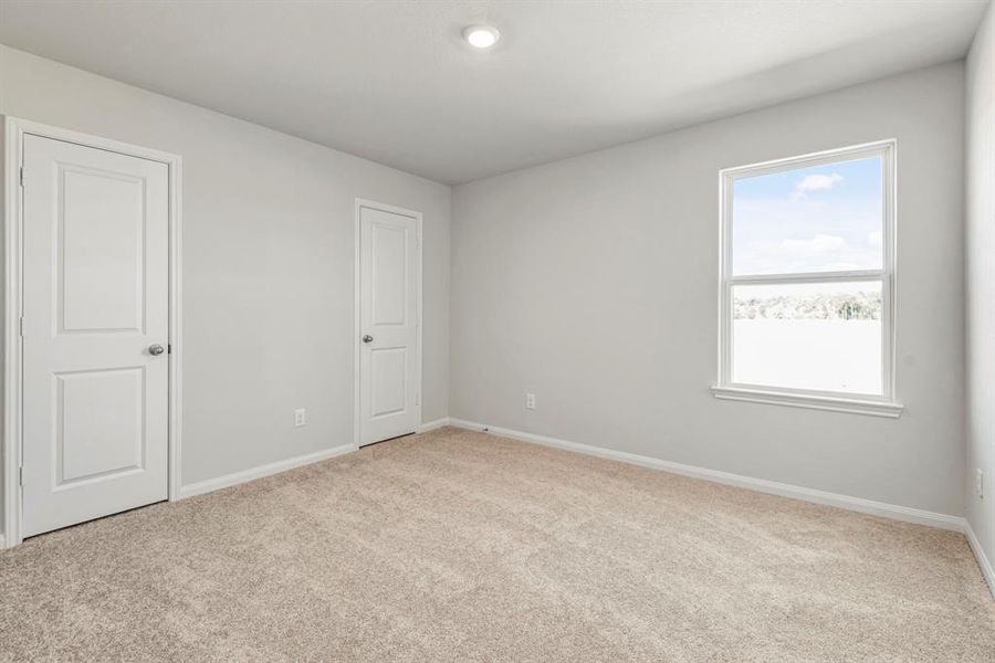 Even the secondary bedroom is spacious and full of natural light.