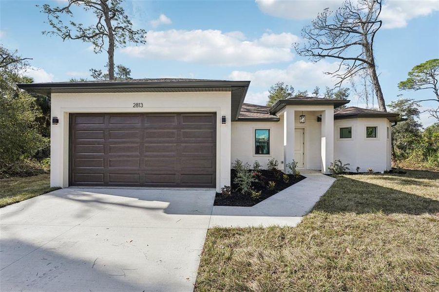 Front exterior of a new home in , North Port, FL, highlighting curb appeal (Image 25).
