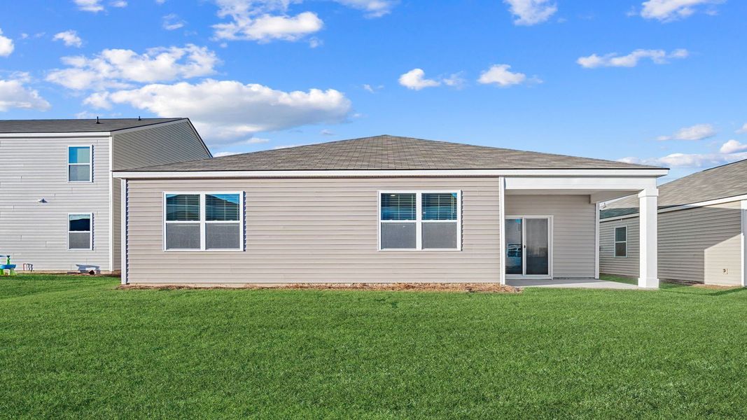 Exterior details and patio area of a home in The Lakes at North Glynn, Brunswick (Image 3).