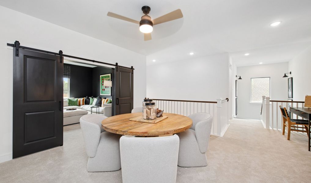 Versatile loft space with plush carpeting