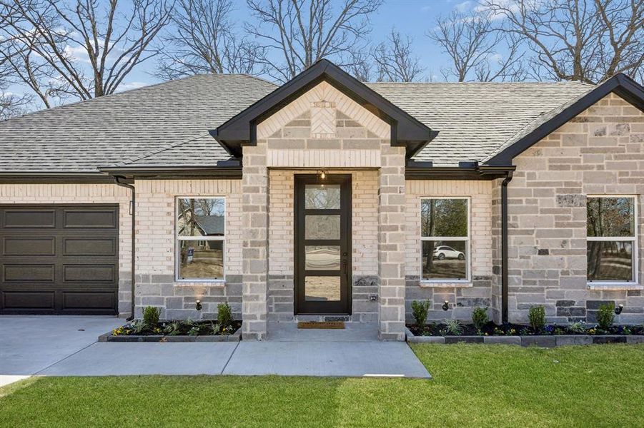 Welcoming front entry with a covered area.