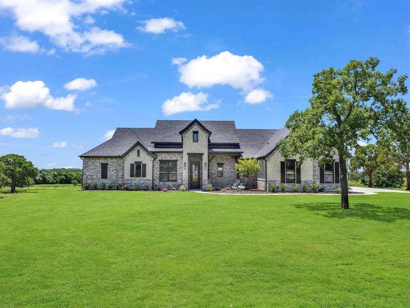 Front exterior of a new home in , Decatur, TX, highlighting curb appeal (Image 22). Front exterior of a new home in , Decatur, TX, highlighting curb appeal (Image 22).