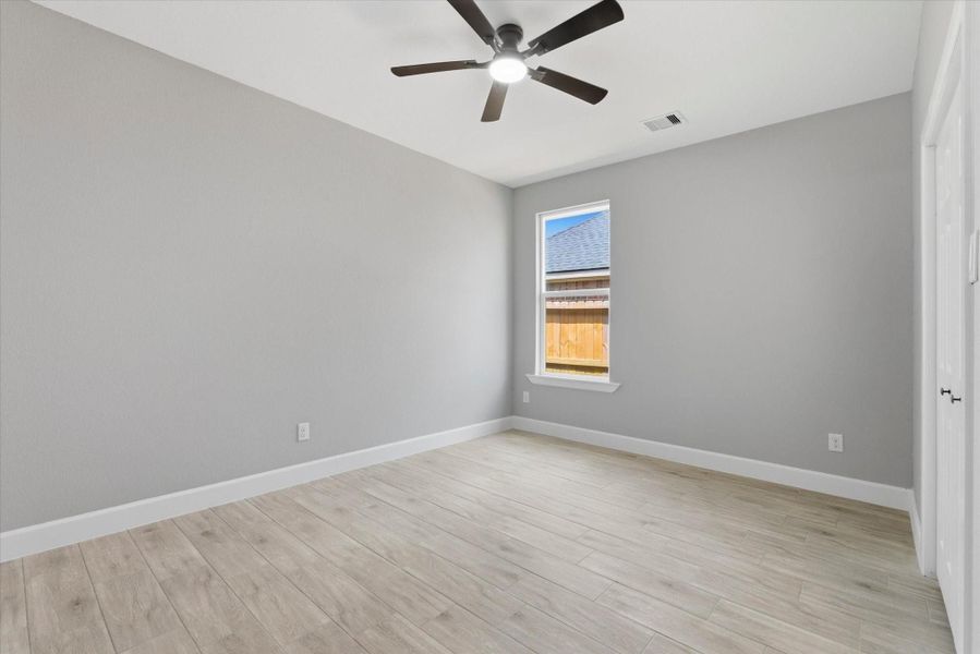Third versatile bedroom - no carpet and complete with a ceiling fan for comfort.