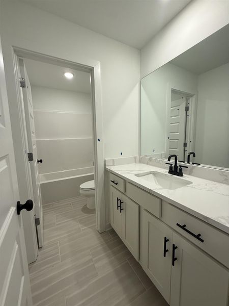 Bathroom with vanity and toilet