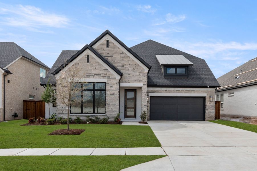 Representative exterior photo of a completed home built from the Aspen by Stonefield Homes in Rio Vista at Kelly Ranch, Aledo, TX (Image 22).