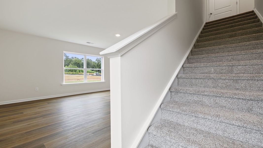 Spacious, unfurnished interior of a new home in Bentley Park, Greenwood (Image 21).