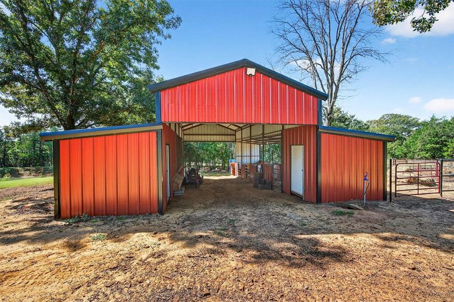 View of outbuilding with an exterior structure View of outbuilding with an exterior structure