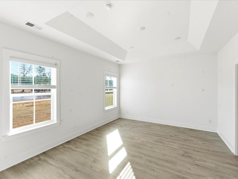 Spacious, unfurnished interior of a new home in The Coves at Lakes of Cane Bay II, Summerville (Image 35).