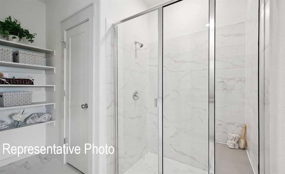 Bathroom with a shower with shower door