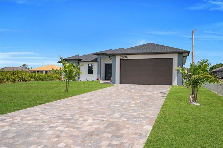 Front exterior of a new home in , Lehigh Acres, FL, highlighting curb appeal (Image 1). Front exterior of a new home in , Lehigh Acres, FL, highlighting curb appeal (Image 1).