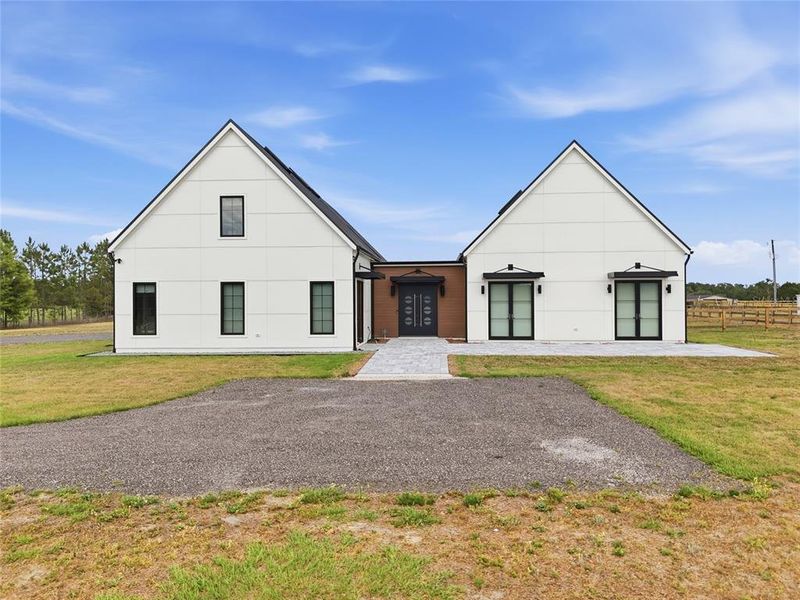 Front exterior of a new home in , Alachua, FL, highlighting curb appeal (Image 23).