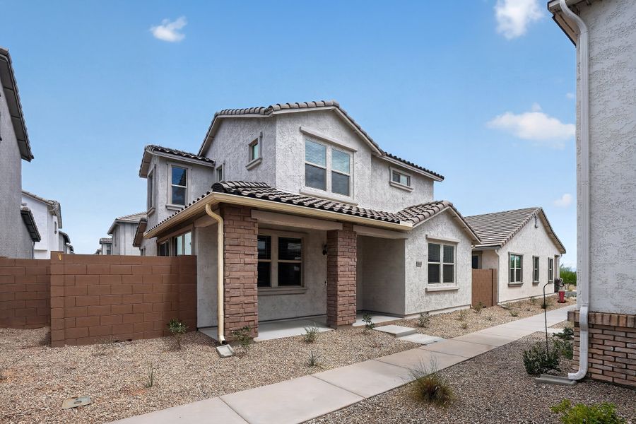 Front exterior of a new home in Rancho Mercado, Surprise, AZ, highlighting curb appeal (Image 19). Front exterior of a new home in Rancho Mercado, Surprise, AZ, highlighting curb appeal (Image 19).
