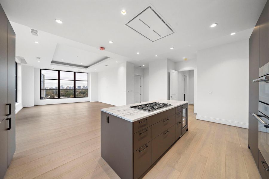 Kitchen features ample storage, gas cooktop & and extra beverage cooler. Kitchen features ample storage, gas cooktop & and extra beverage cooler.