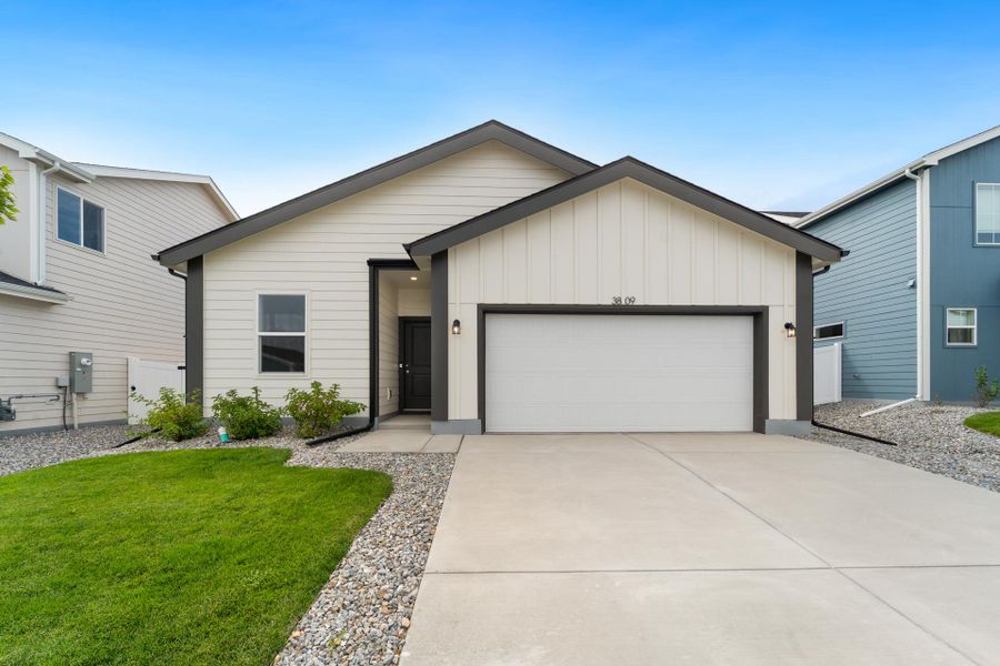 Front exterior of a new home in Liberty Draw, Evans, CO, highlighting curb appeal (Image 2). Front exterior of a new home in Liberty Draw, Evans, CO, highlighting curb appeal (Image 2).
