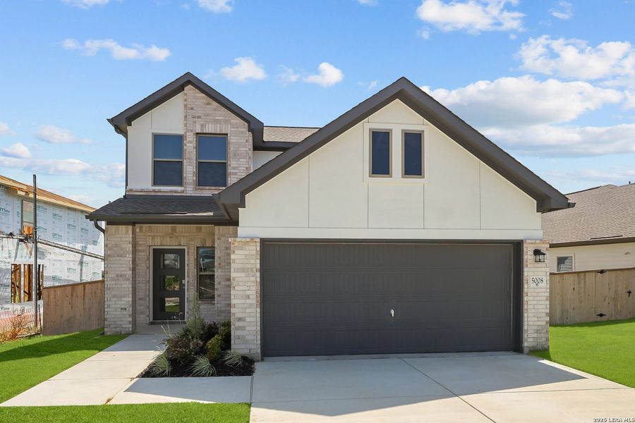 Front exterior of a new home in The Parklands, Schertz, TX, highlighting curb appeal (Image 24).