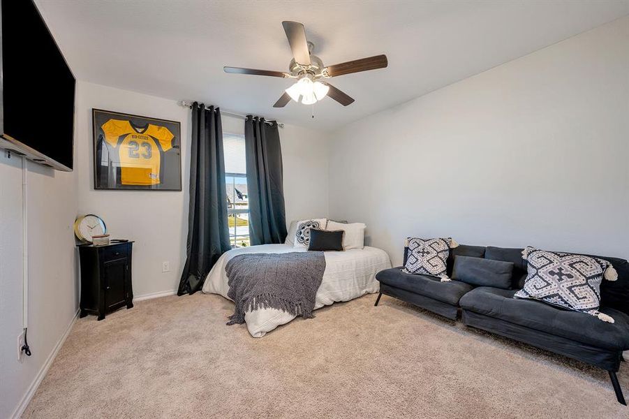 Bedroom with carpet and ceiling fan
