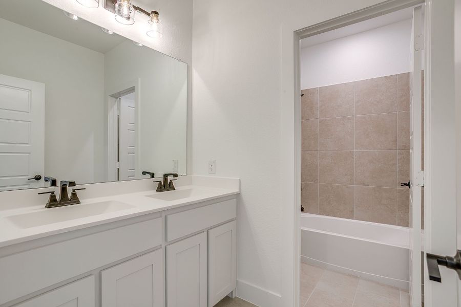 Representative furnished interior of a home built from the Valera by Graham Hart Home Builder in Bear Ridge, Burleson (Image 5).