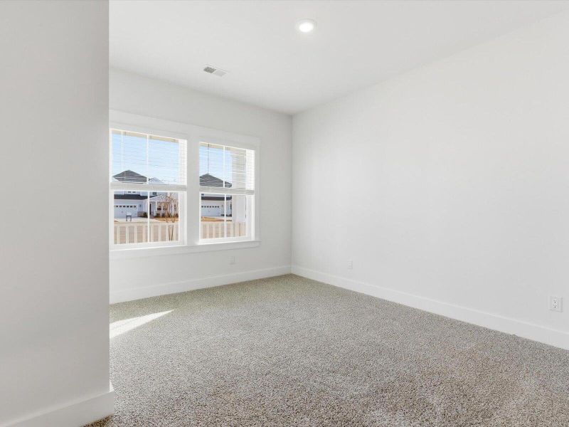 Spacious, unfurnished interior of a new home in The Coves at Lakes of Cane Bay, Summerville (Image 35).