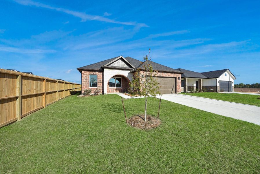 Front exterior of a new home in Hill & Dale Ranch, Splendora, TX, highlighting curb appeal (Image 20).