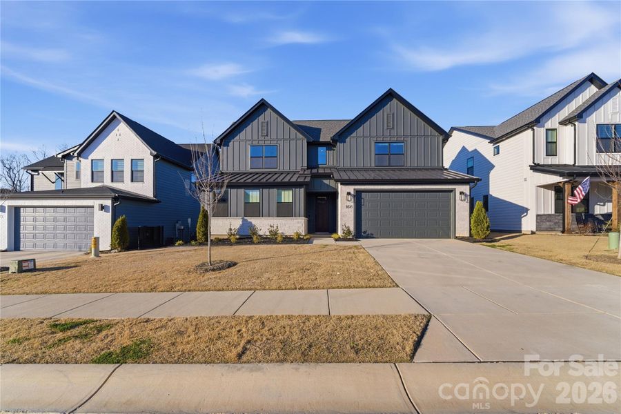 Front exterior of a new home in Windell Woods, Tega Cay, SC, highlighting curb appeal (Image 25).