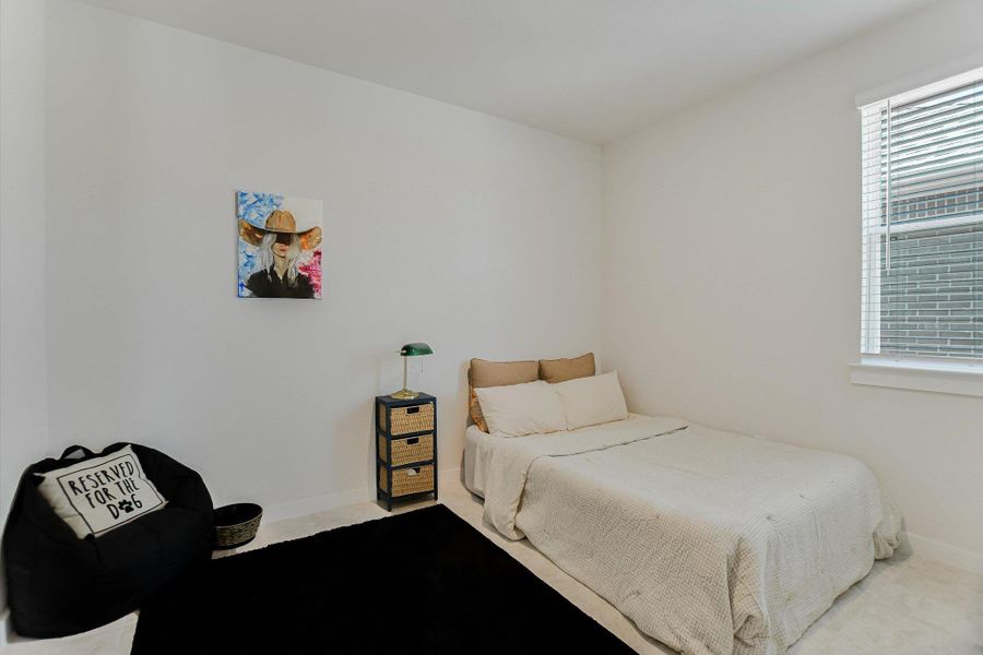 A well-lit bedroom provides comfortable living space. A well-lit bedroom provides comfortable living space.