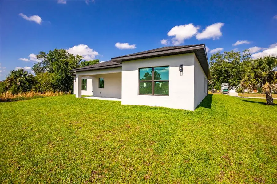 Exterior details and patio area of a home in , Port Charlotte (Image 37).