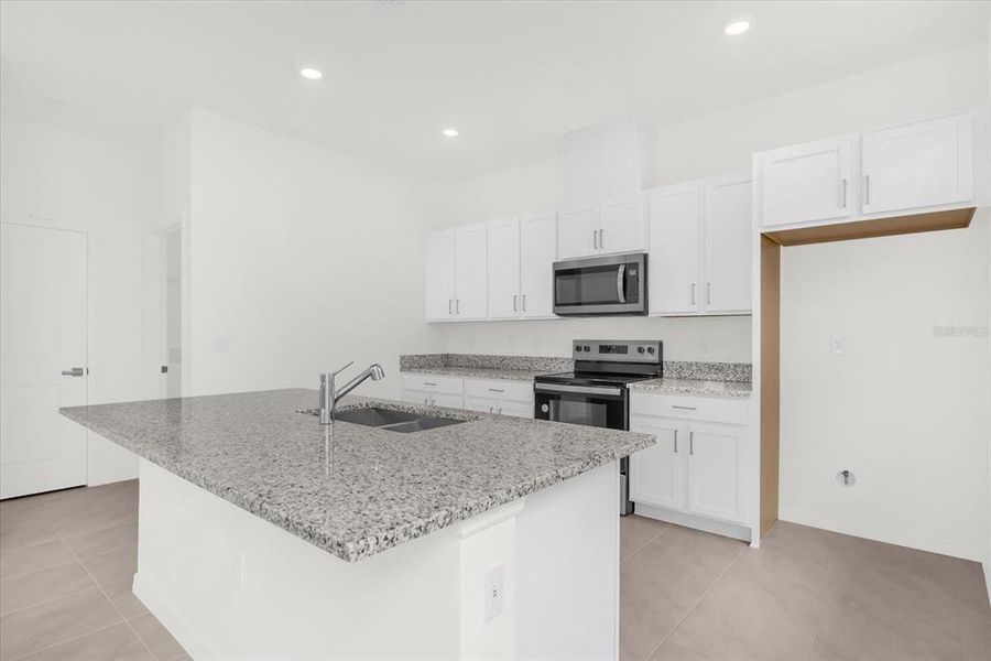 Furnished interior view inside a new home in Bellaviva III at Westside, Davenport (Image 6).