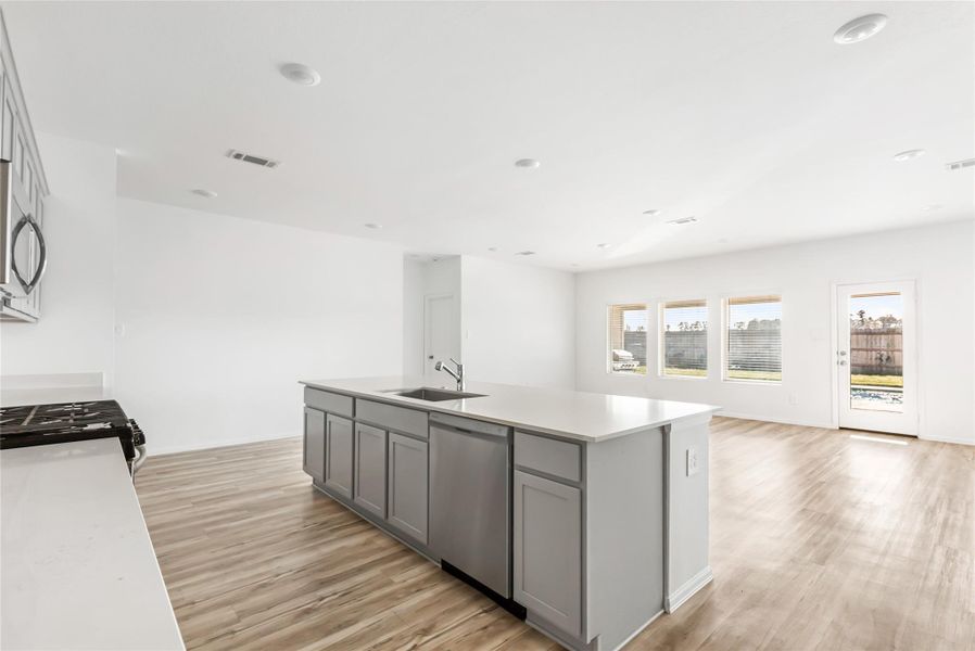 View from kitchen into the family room and dining area. Very open floor plan. Light and bright! Perfect for entertaining! View from kitchen into the family room and dining area. Very open floor plan. Light and bright! Perfect for entertaining!