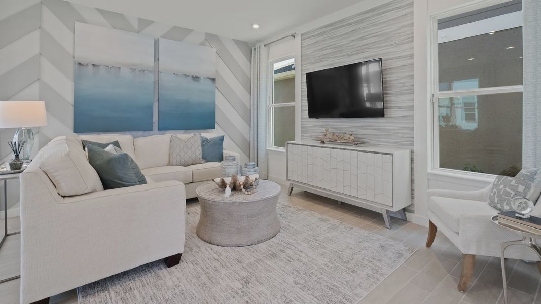 Family room with 2 large windows at a DRB Homes Ambersweet model at the Trinity Place community. Family room with 2 large windows at a DRB Homes Ambersweet model at the Trinity Place community.