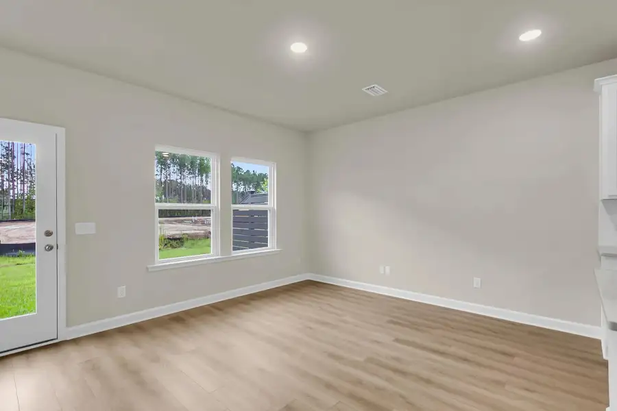 Gather in this cozy family room with plenty of natural light.
