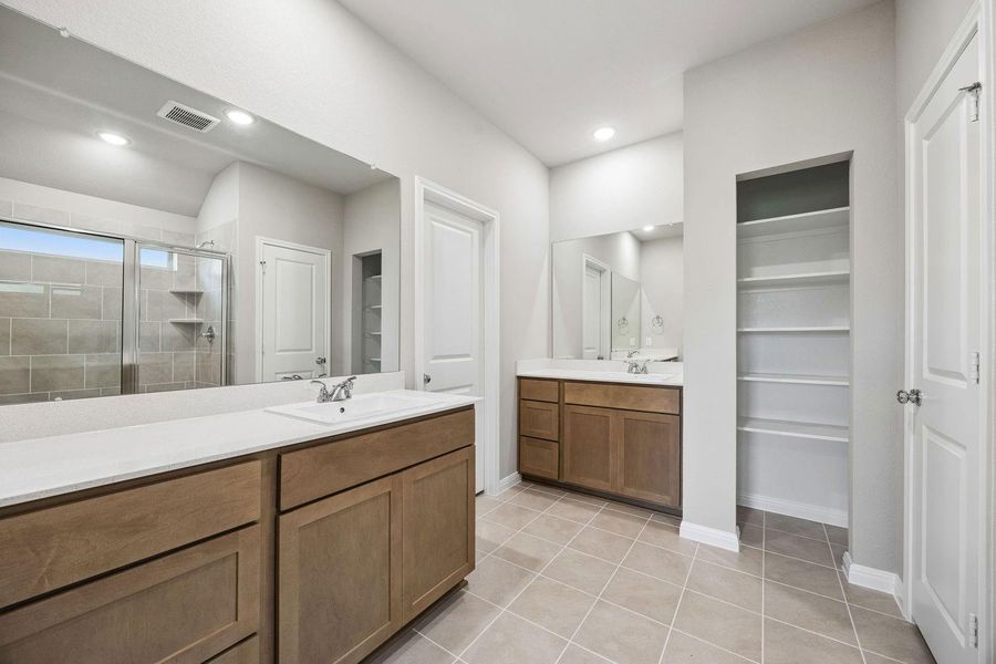 Primary Bathroom in the Sabine home plan by Trophy Signature Homes – REPRESENTATIVE PHOTO