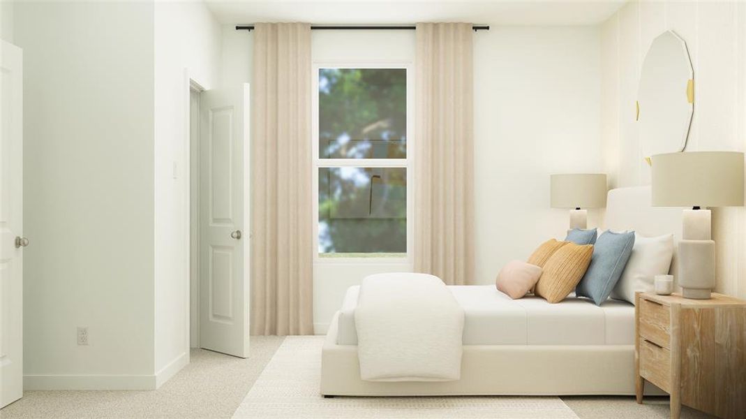 Bedroom featuring light carpet