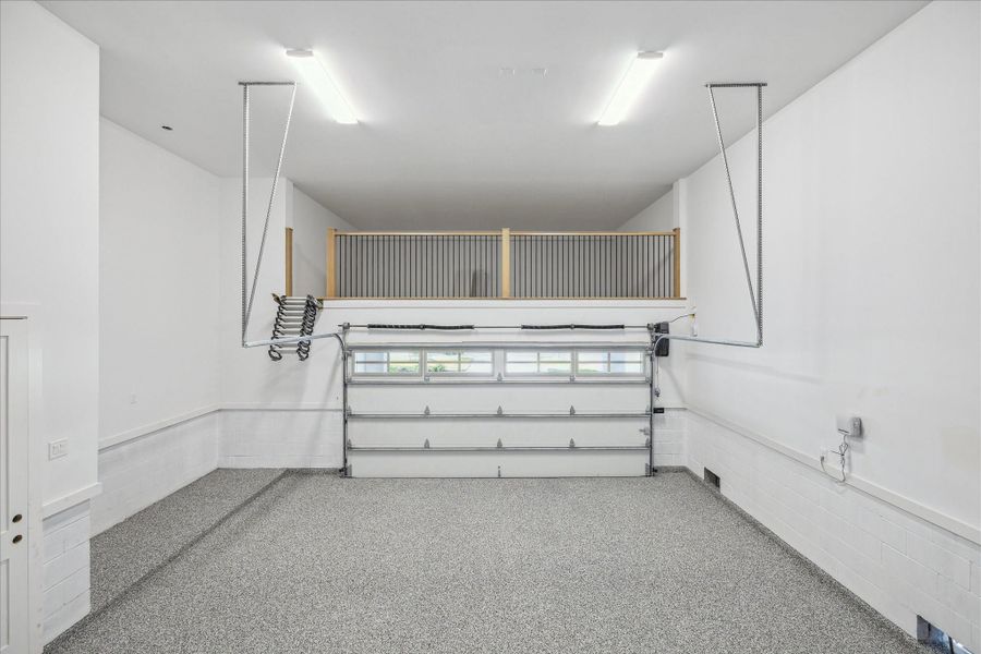 Huge garage with finished out storage area above.